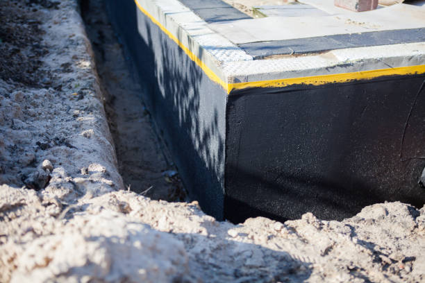Professional Waterproofing technician working in Goldsmith, IN